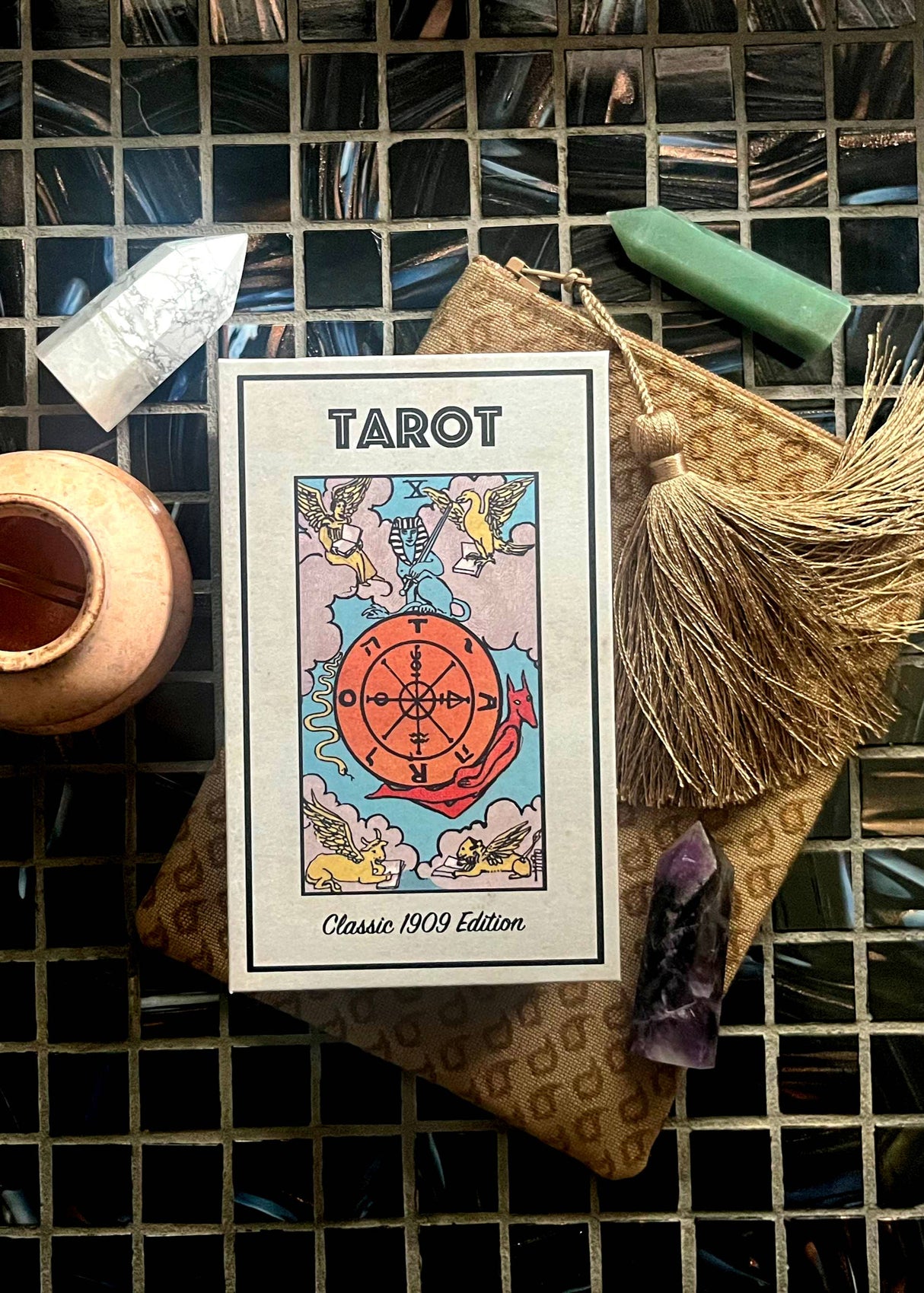Tarot card deck with mystical items on a grid background